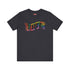 Election 2024 t-shirt with "VOTE" printed in large, colorful letters. Each letter features a different color from the rainbow spectrum, styled in a groovy 70s-inspired font.